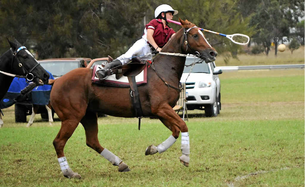 Callum Lancaster races for the ball in the U12s exhibition finals against NSW yesterday.